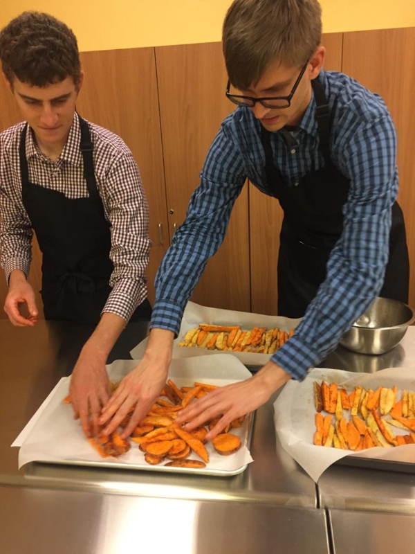Mark Jedrzejczak and Jim Snitzer get ready to roast sweet potatoes for a side