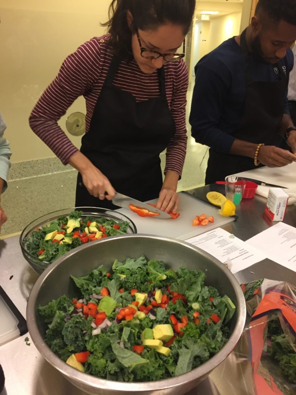 Annalise Littman prepares a colorful kale salad