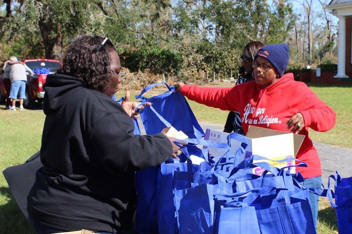Sandra Edwards distributing goods 