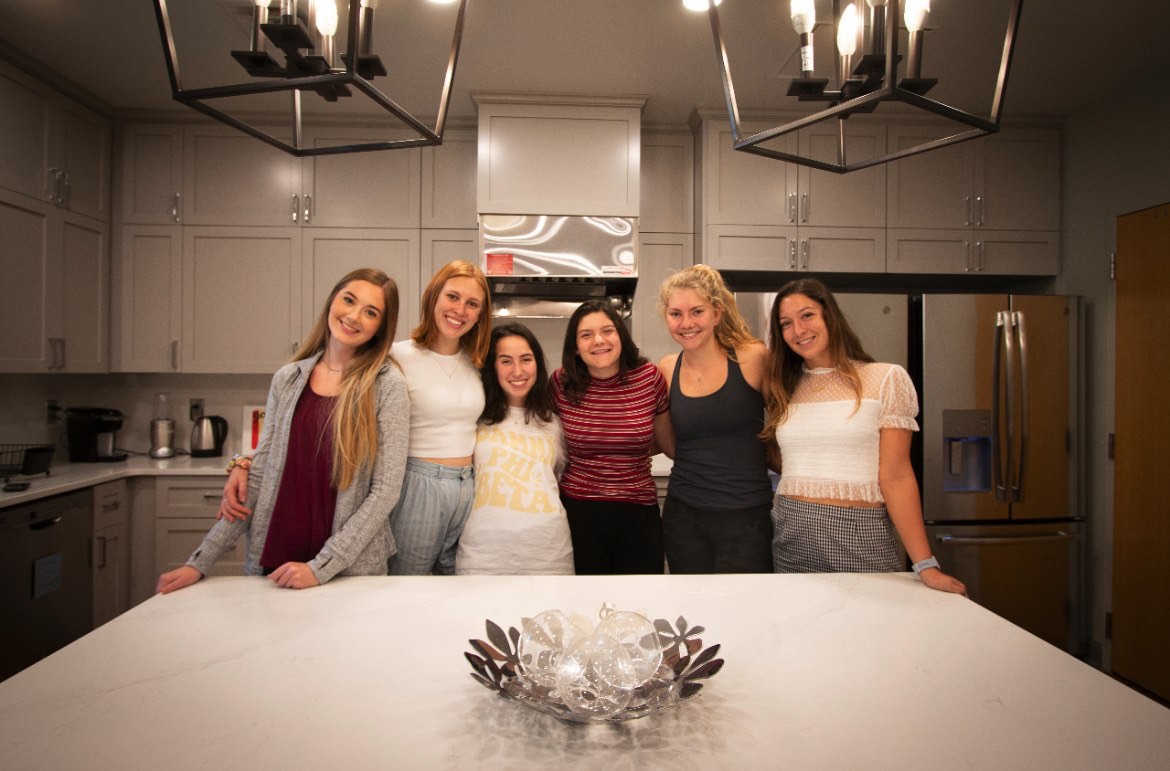 6 sorority sisters enjoying renovated kitchen 